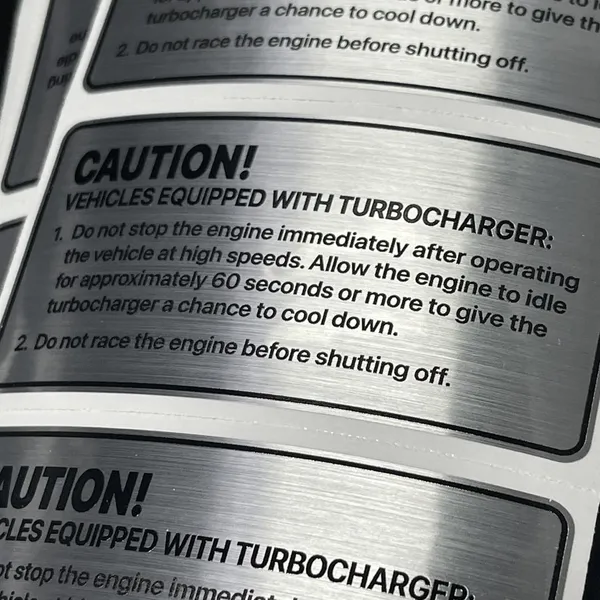 Metallic caution labels